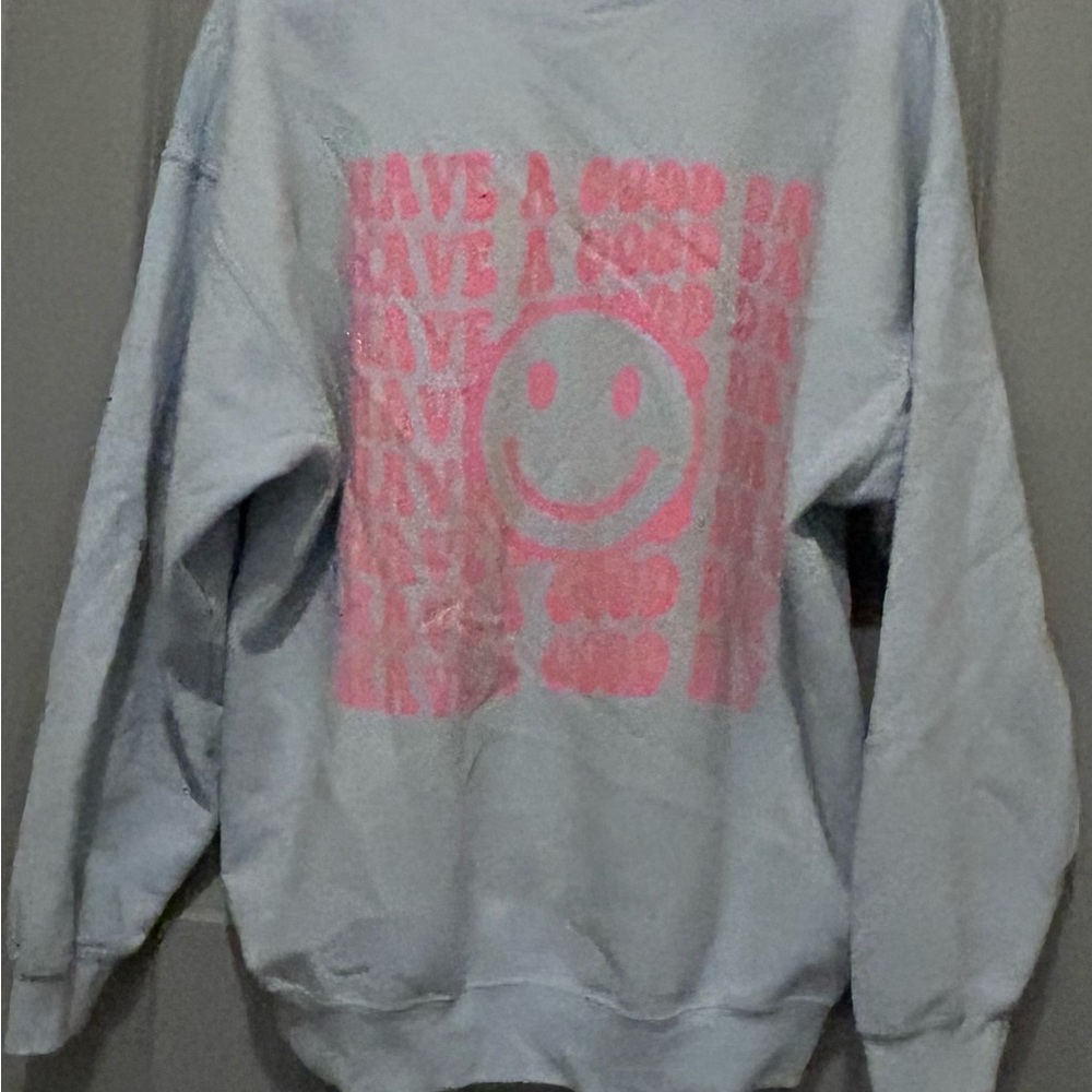 This writing is on the back of the sweatshirt